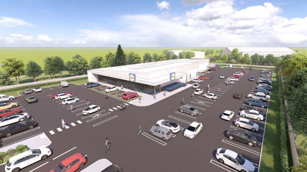 Artist's impression of what the new store could look like with cars parked outside a brand new, square building