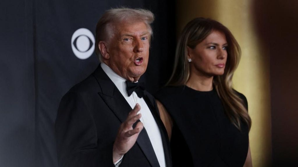 Donald Trump and wife Melania photographer while arriving at an event