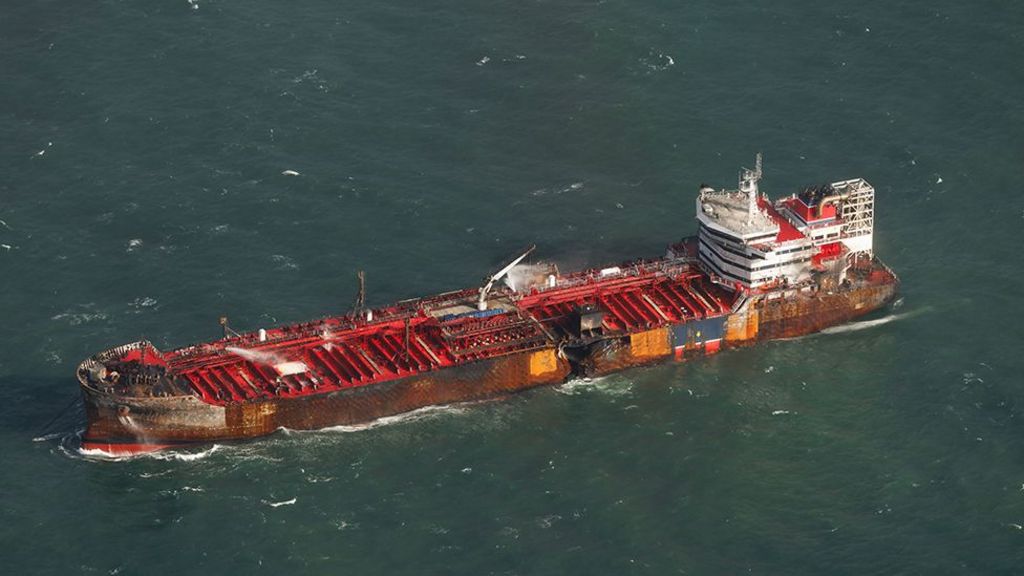 Aerial view of the Stena Immaculate with a hole in its side and signs of burn marks around the hull