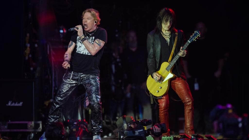 Axl Rose and Richard Fortus performing at Glastonbury