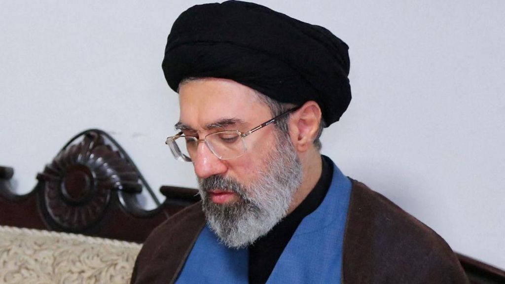 Wearing a black turban and spectacles, Mojtaba Khamenei is pictured during a visit to Hezbollah's office in Tehran in 2024. 
