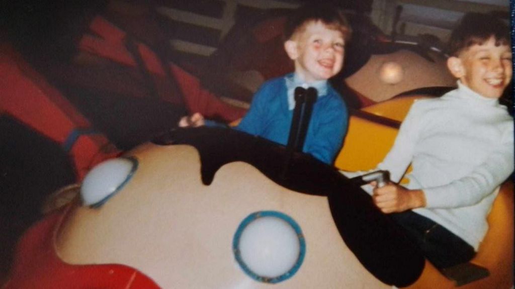 Pete and Gerald Quigley as children riding a fair ride