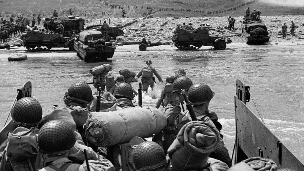 US troops arrive in a landing craft on a Normandy beach on 6 June, 1944 (black and white image)
