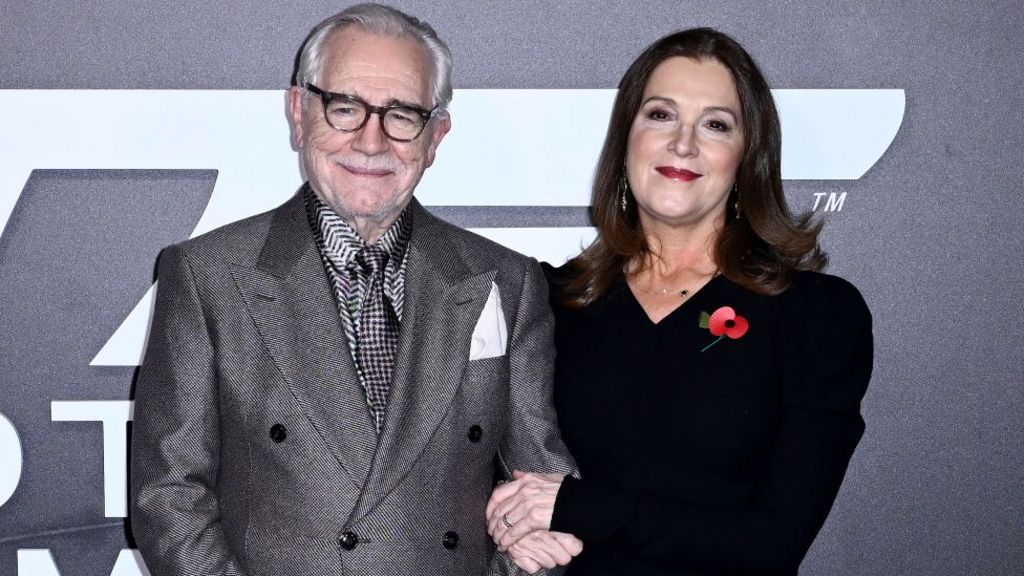 Brian Cox and Barbara Broccoli arrive at the "007: Road To A Million" Premiere at Battersea Power station on November 02, 2023 in London, England