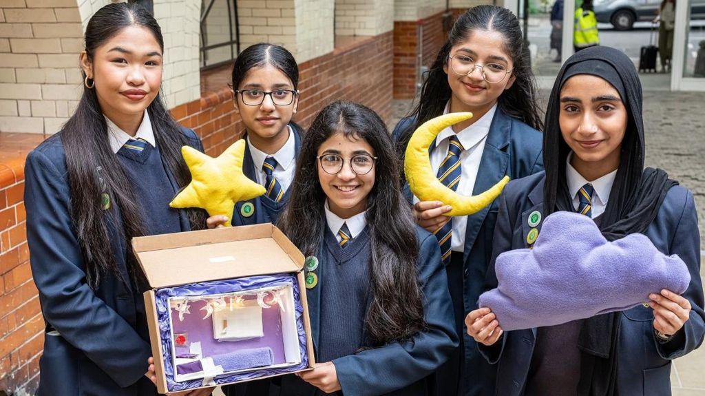 Bradford Girls' Grammar School holding their sleep pod model