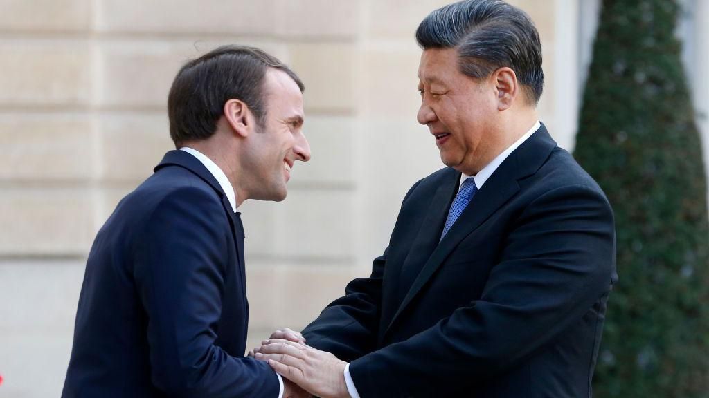 French President Emmanuel Macron greets Chinese President Xi Jinping after their meeting at the Elysee Presidential Palace on March 26, 2019 in Paris, France. Xi Jinping is on a state visit to France from March 24 to 26, 2019.