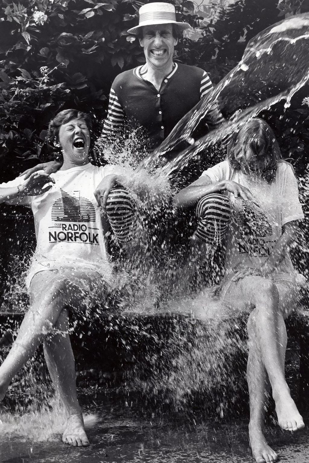 Louise Priest (left) is doused with a bucket of water