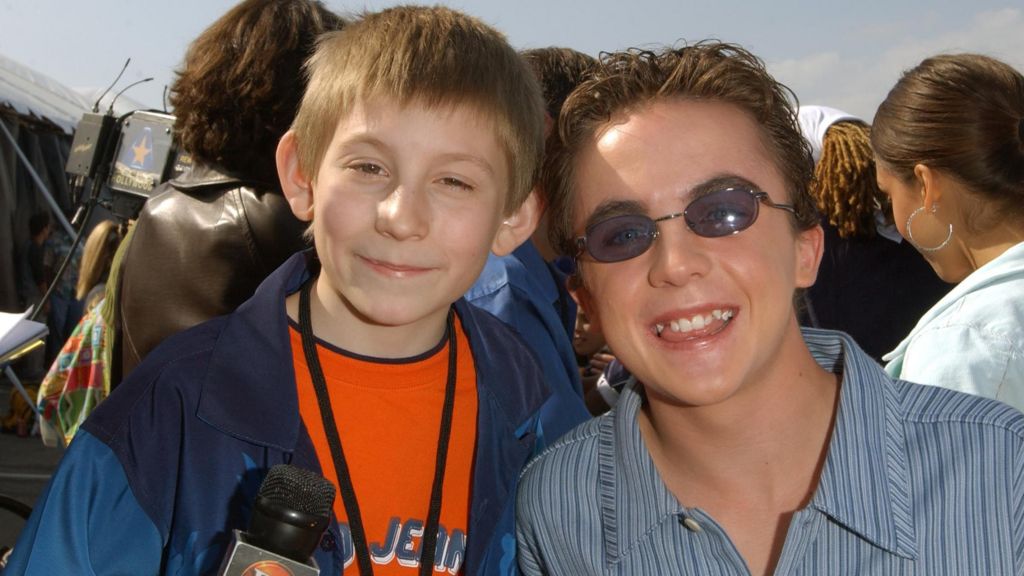 Erik Per Sullivan (left) and Frankie Muniz pictured together in 2002 at the Nickelodeon Kids' Choice Awards in Santa Monica, California