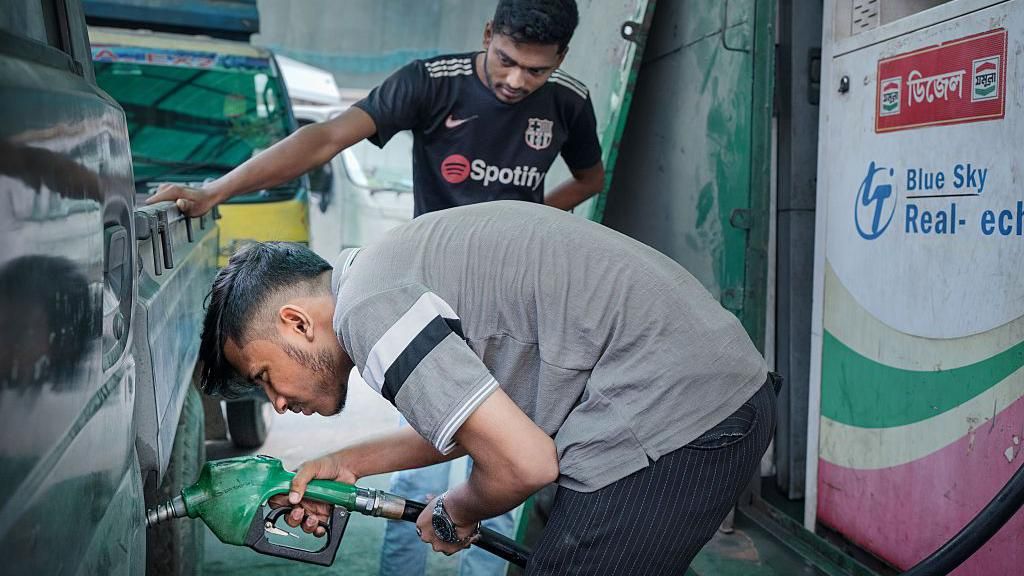 A man refuels a vehicle at a petrol station in Dhaka, Bangladesh, on Monday, March 9, 2026.
