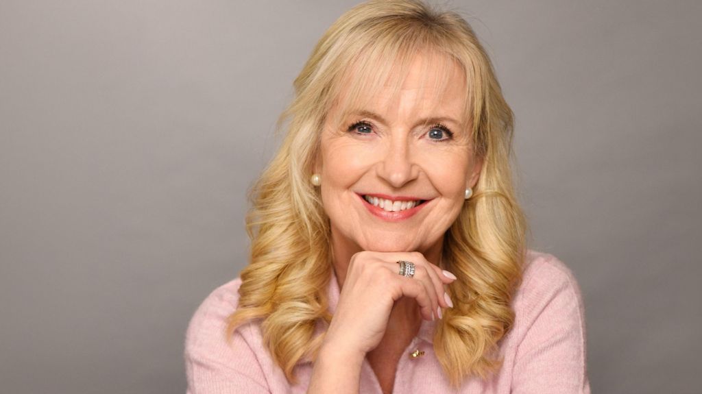 Outgoing BBC Weather presenter Carol Kirkwood smiles in a portrait taken to mark her departure from the BBC. She is wearing a light pink top.