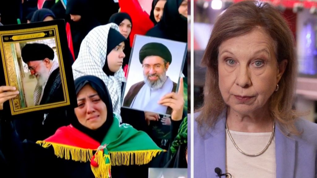 A lady who is crying holding up two pictures. On the right, Lyse Doucet