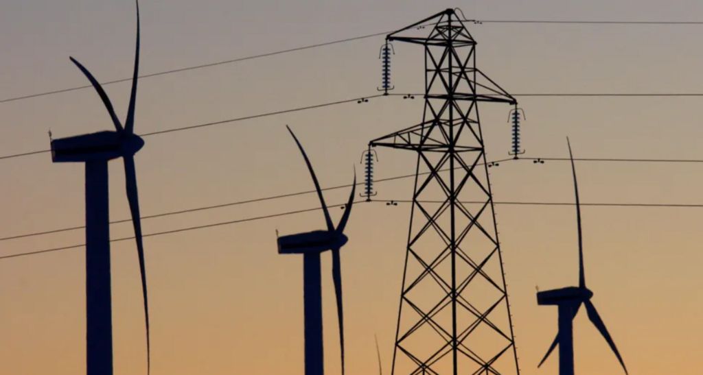 wind turbines and an electricity pylon.