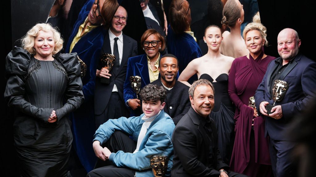 The cast and makers of Adolescence posing with their Bafta trophies