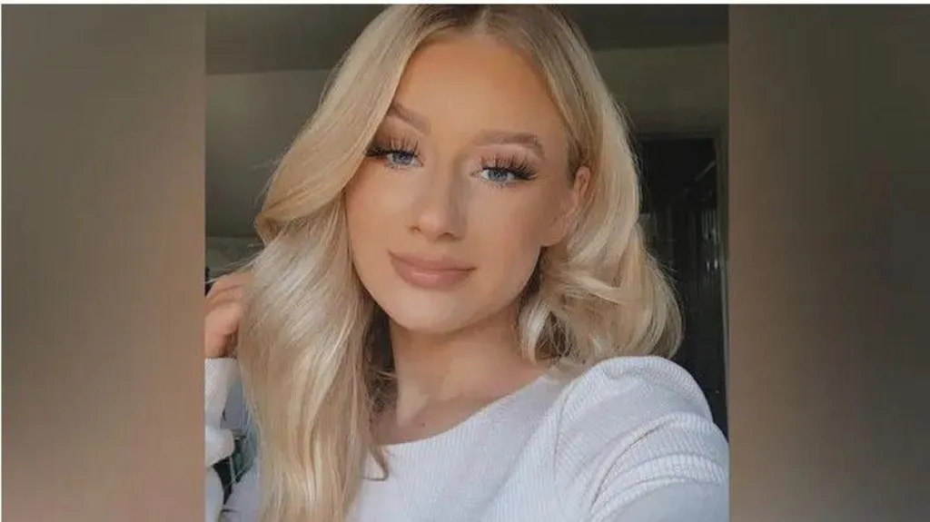 Lucy Harrison, who has long blonde hair resting on top of her head, smiles at the camera