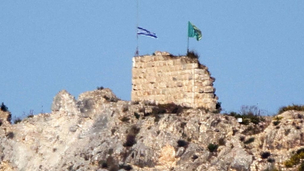 The Beaufort castle which sits atop a hill, with two flags flying from the top of the castle - an Israeli flag and what appears to be a flag of the Golani Brigade - on a sunny day in southern Lebanon on Sunday.