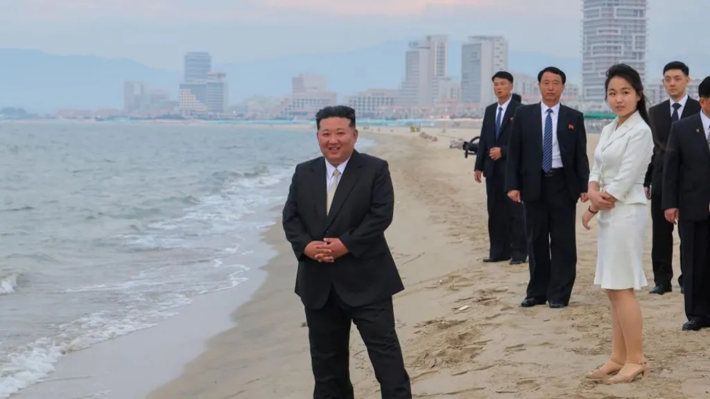 A photo released by the official North Korean Central News Agency (KCNA) shows North Korean leader Kim Jong Un (L) and his daughter Kim Ju Ae (3-R) standing on a beach during a ceremony marking the opening of the Wonsan Kalma Coastal Tourist Zone in Wonsan, North Korea, 24 June 2025 (issued 26 June 2025).