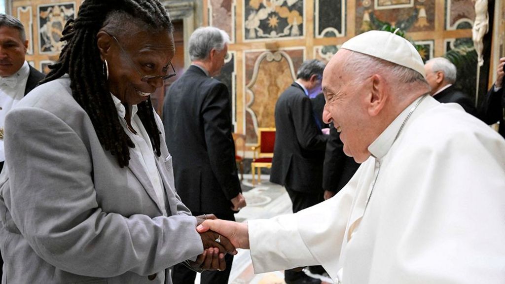 Pope Francis greets Whoopi Goldberg as he meets with comedians during a cultural event at the Vatican, June 14, 2024