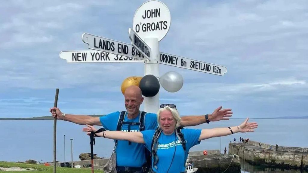 Marcus and Lisa Sutton at John O'Groats after completing their challenge