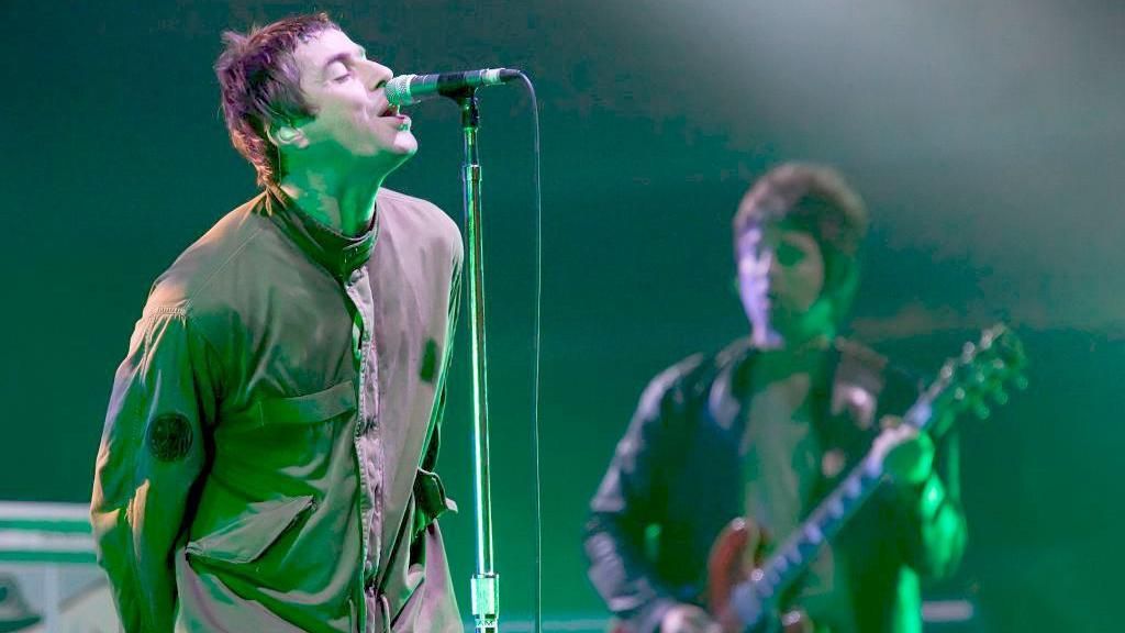 Liam and Noel Gallagher onstage as Oasis at the Melt! Festival in Germany in 2009