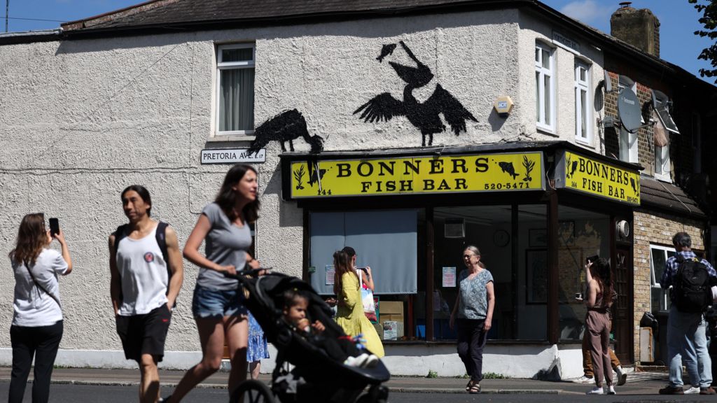 People walking past Bonners Fish and Chip shop