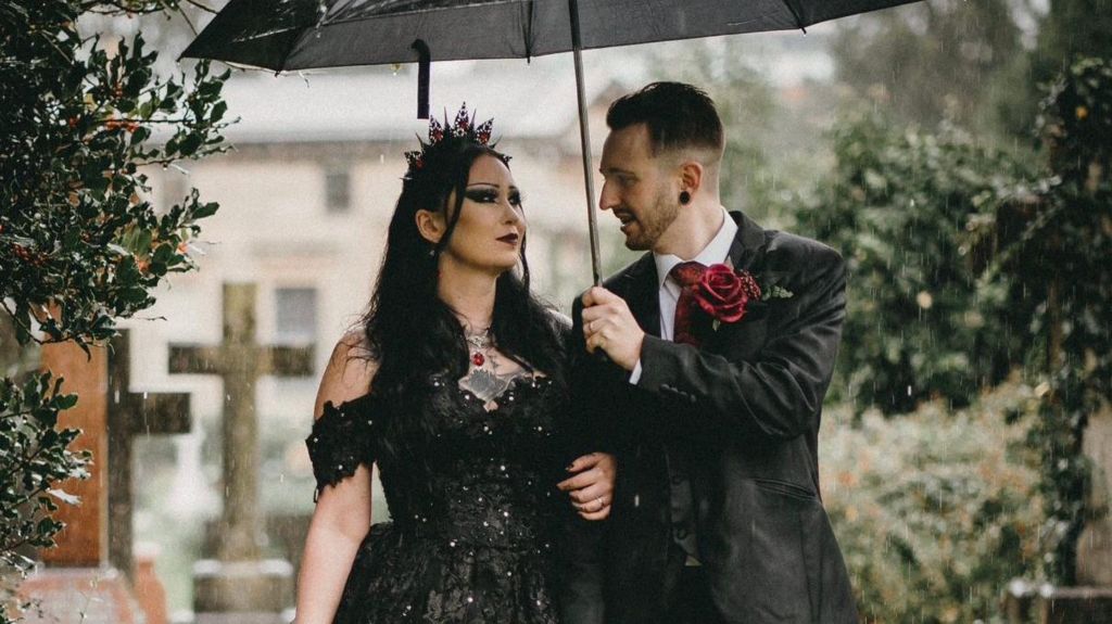 Hannah and Mathew pose for wedding photos in a cemetery