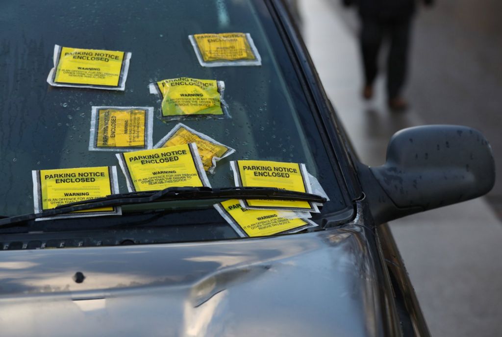Parking fines stuck to a windscreen