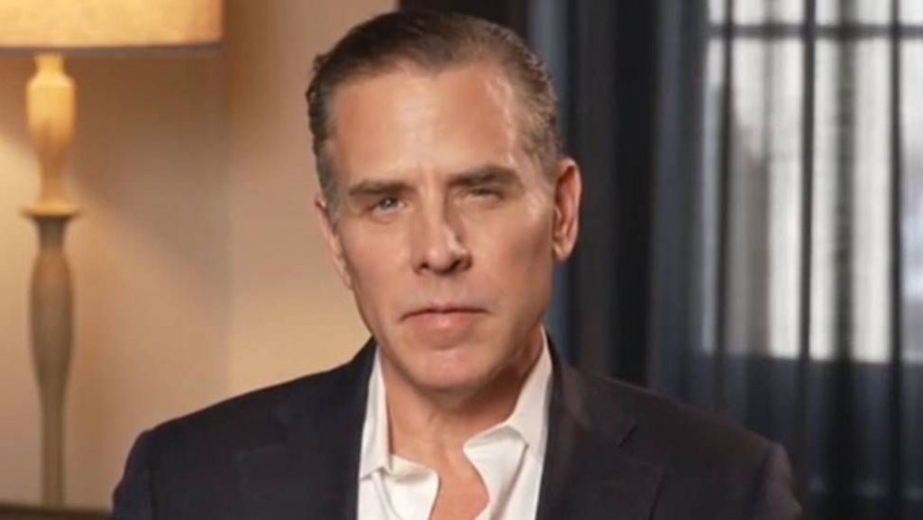 A head and shoulders shot of Hunter Biden in a white shirt and dark jacket