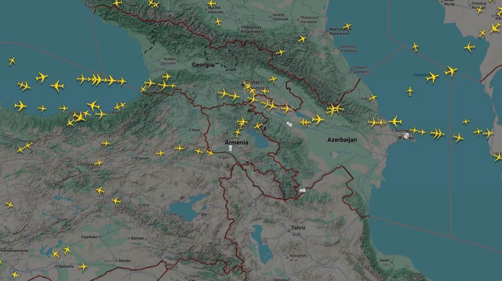 Map of Azerbaijan and surrounding countries taken from Flightradar24's website, showing in yellow the planes flying over in real time. The are scattered about in some areas, none are flying over northern Iran and none over southern Azerbaijan. There is a cluster over northern Azerbaijan.