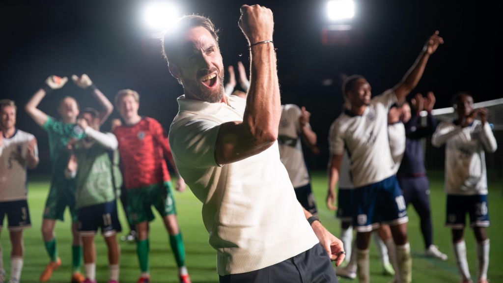 Joseph Fiennes as England manager Gareth Southgate, giving a celebratory fist gesture