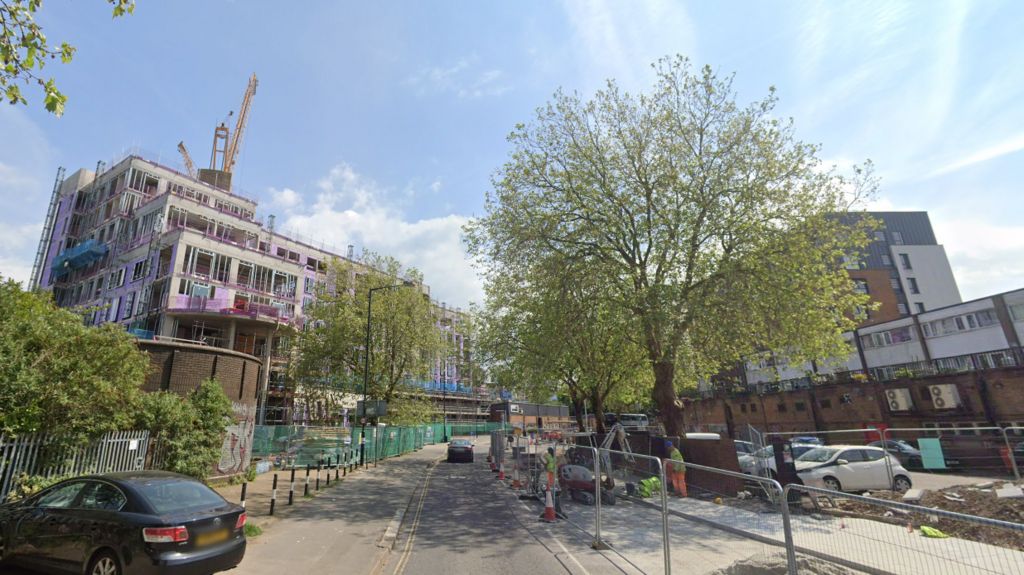 A Google streetview image of Dalby Avenue. The road is partially closed as works are carried out, with construction of a housing block visible to the left.  