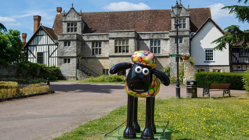 Shaun the Sheep model with a brightly patterened head and body, and dark legs and ears