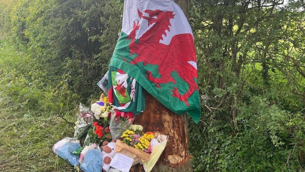 Welsh flag and floral tributes