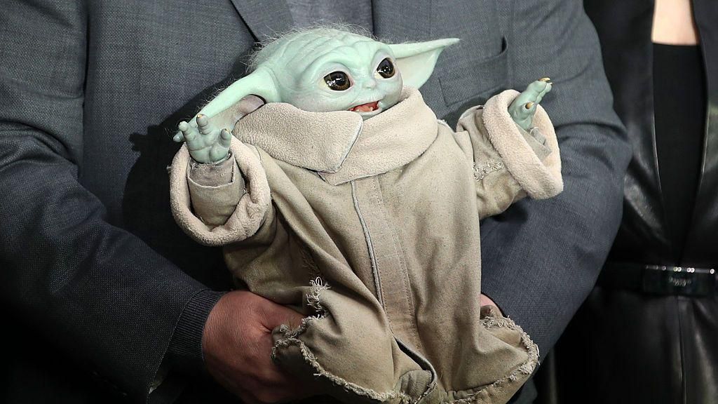 Chilean-US actor Pedro Pascal holds a Grogu as they pose on the red carpet upon arrival to attend the UK fan event for 'Star Wars: The Mandalorian and Grogu' at Cineworld Leicester square, central London of May 7, 2026.