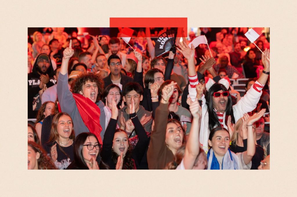 Fans react during a live watch party during the grand-final at the 69th Eurovision Song Contest