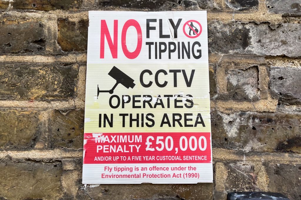 Poster warning about fly-tipping and the use of CCTV in the area