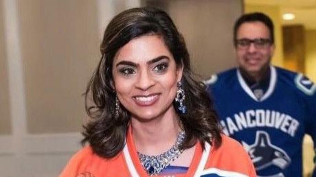 Shelina Gwaduri pictured on her wedding day nine years ago donning an Edmonton Oilers jersey