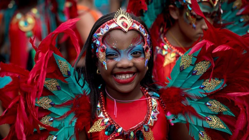 Smiling girl at Notting Hill Carnival. 