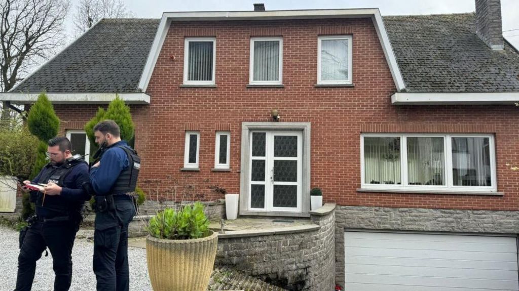 Belgian police outside a property
