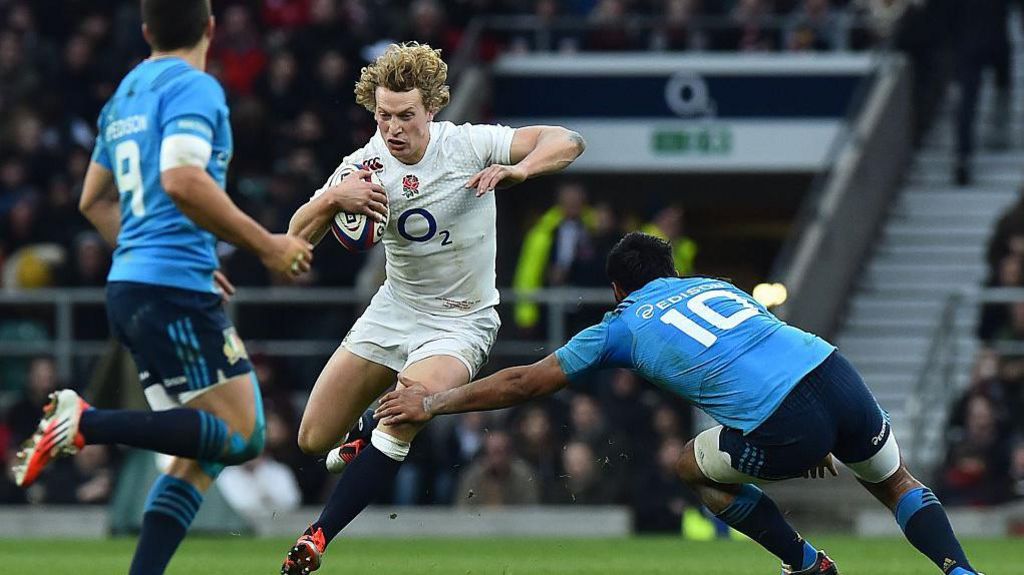 England's Billy Twelvetrees tries to run through Italy's defence in a match in 2015