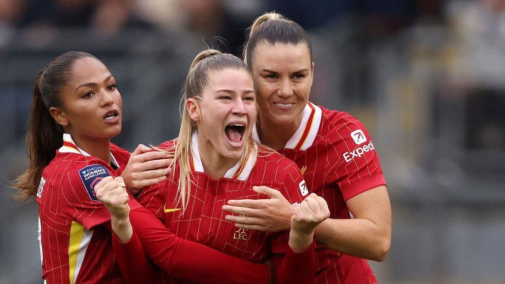 Marie Hobinger (centre) celebrates scoring for Liverpool