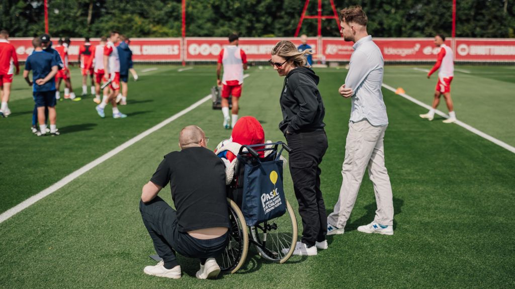 James with mum and dad at Nottingham Forest's training ground