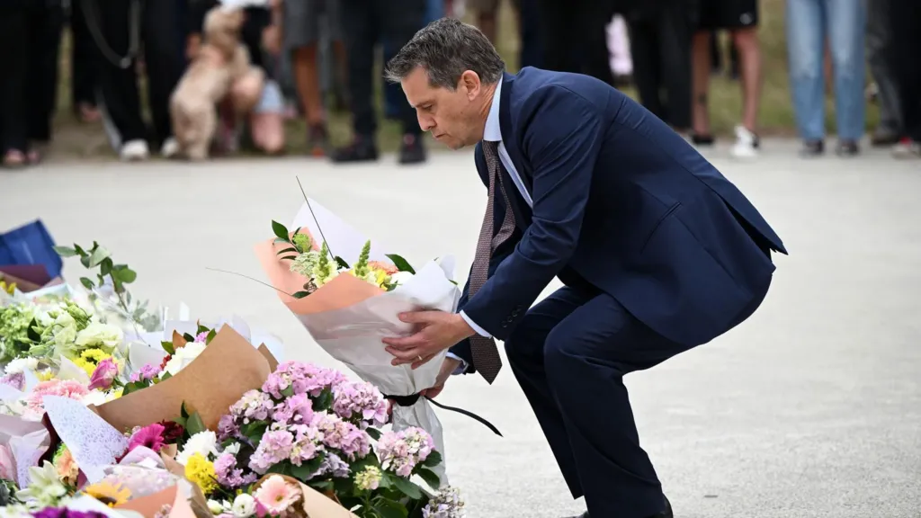 Ryan Park places flowers at Bondi Beach memorial
