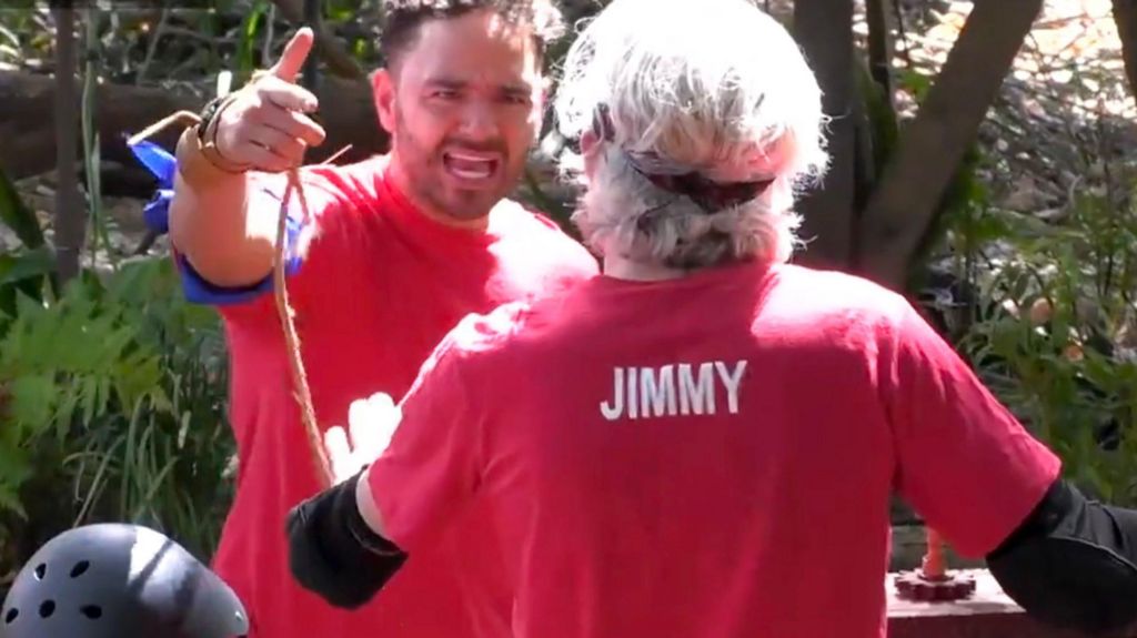 Adam Thomas angrily pointing at Jimmy Bullard in a still from I'm A Celebrity