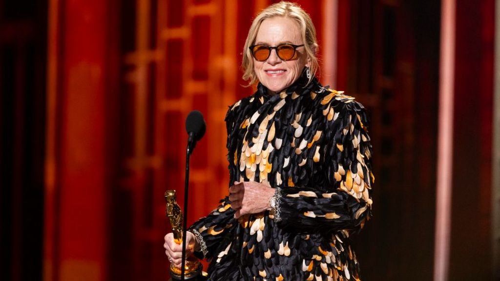 Weapons star Amy Madigan on stage at the Academy Awards, accepting the trophy for best supporting actress