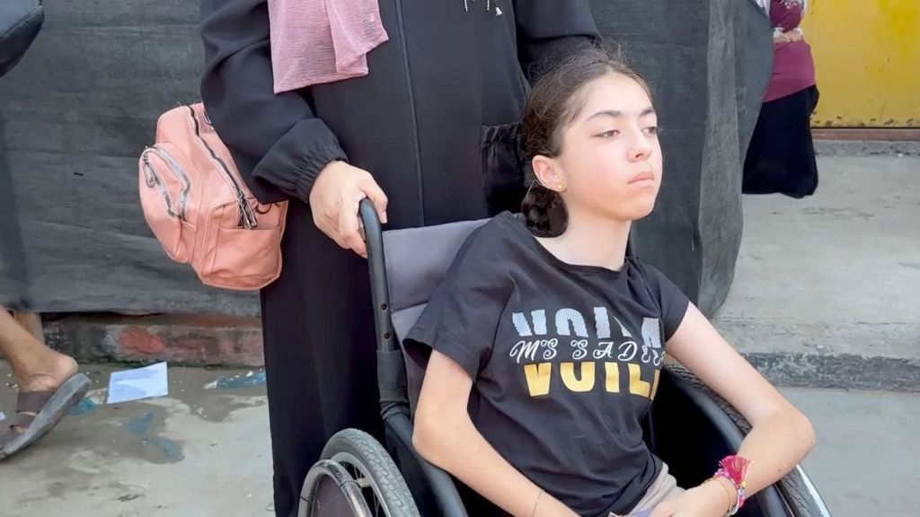 Lamis Abu Selim is pushed in her wheelchair by her mother (30/07/24)