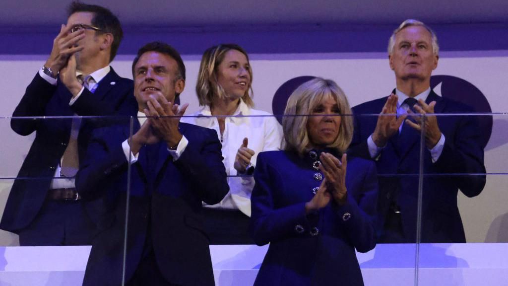 France's President Emmanuel Macron (front L) and his wife Brigitte Macron (front R), next to newly appointed French Prime Minister Michel Barnier (R)