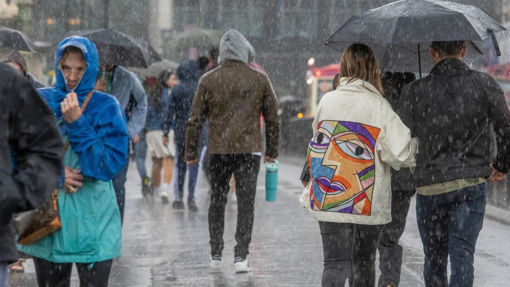 People walking in the rain