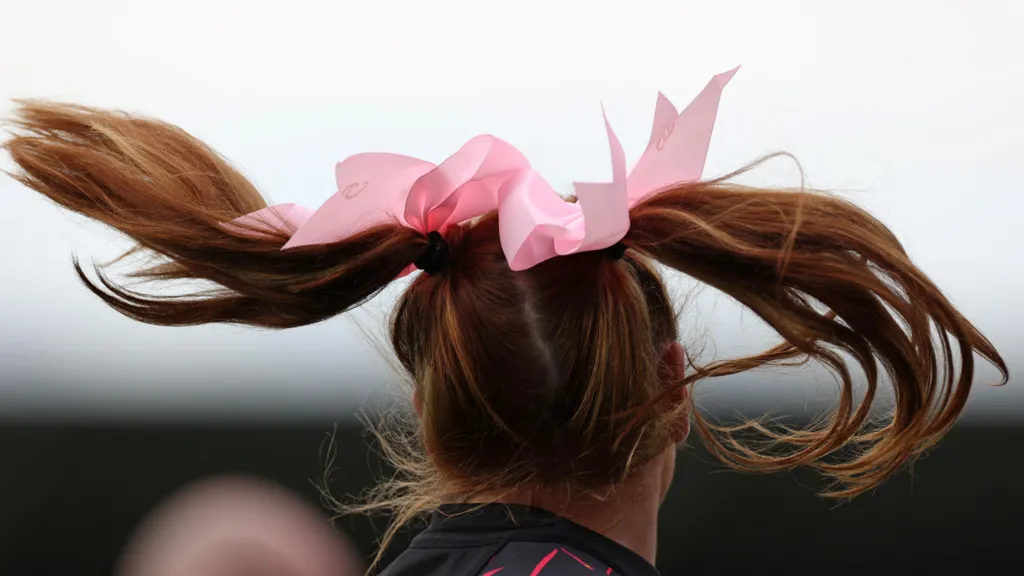 The back of Georgia's hair, showing two big bows on her pigtails
