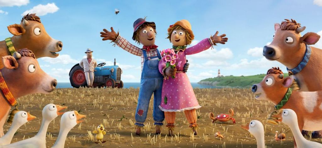 Two scarecrows in a field with a tractor in a background, surrounded by geese and cows