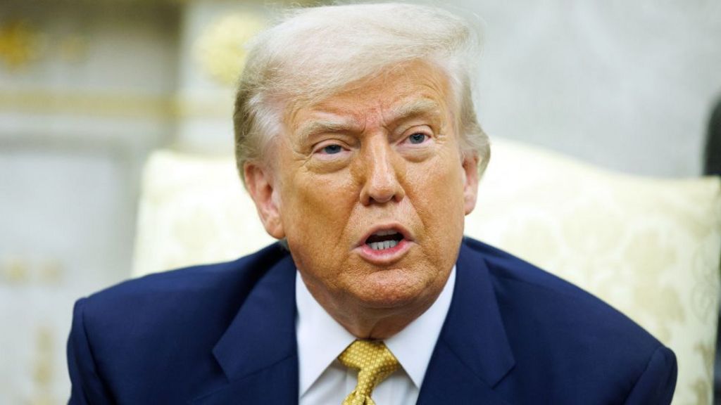 US President Donald Trump at the White House, pictured wearing a gold tie in the oval office, Washington, USA - 16 Jul 2025